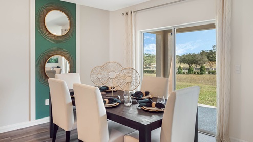 Dining room with 6 seat table and patio doors