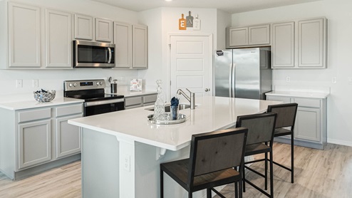 Kitchen with walk in pantry and stainless steel appliances