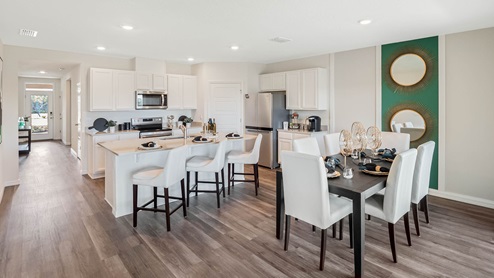 Open concept living room with dining room and kitchen in view to the entrance