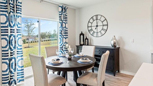 Dining space with round table and patio doors