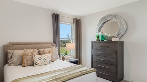 Guest bedroom with queen size bed and dresser