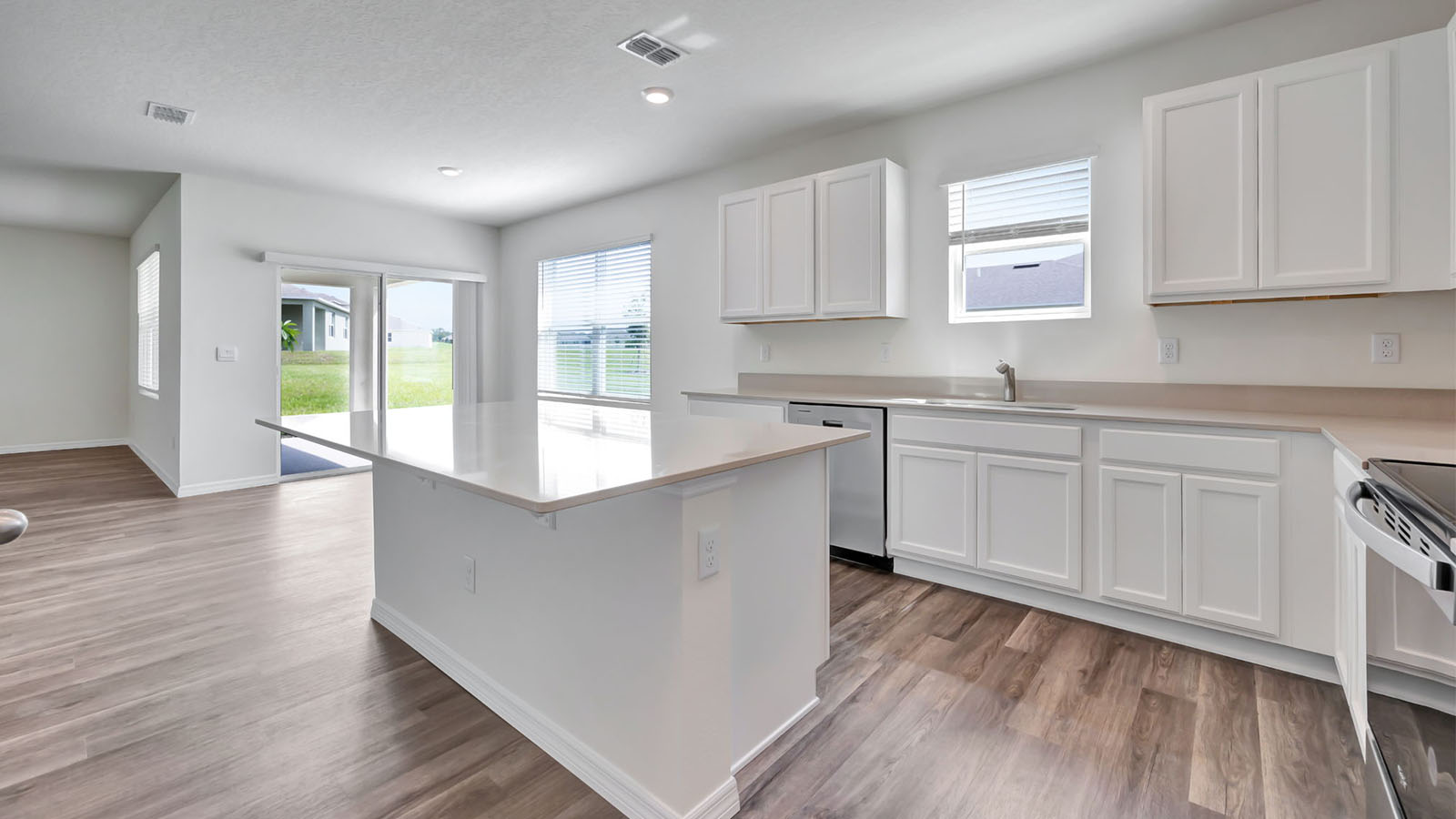 Kitchen island  and view to dining room and lanai