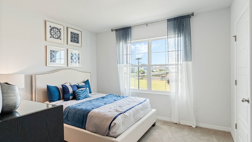 Upstairs guest bedroom with full size bed and dresser
