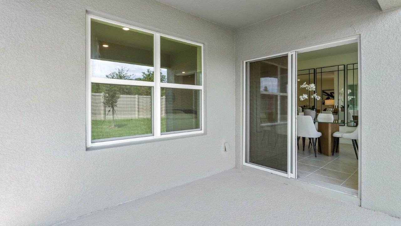 covered patio with doors to dining room