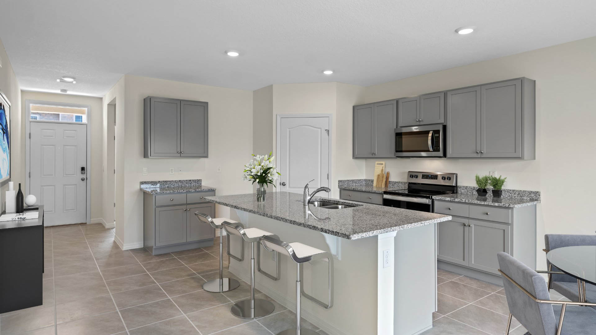 Virtually Staged Kitchen with gray cabinets and large island