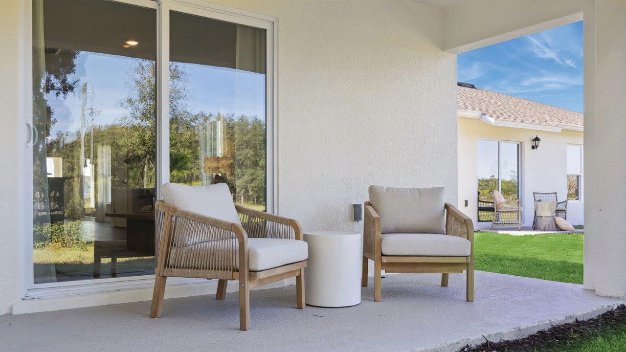 Rear patio with 2 chairs and small table