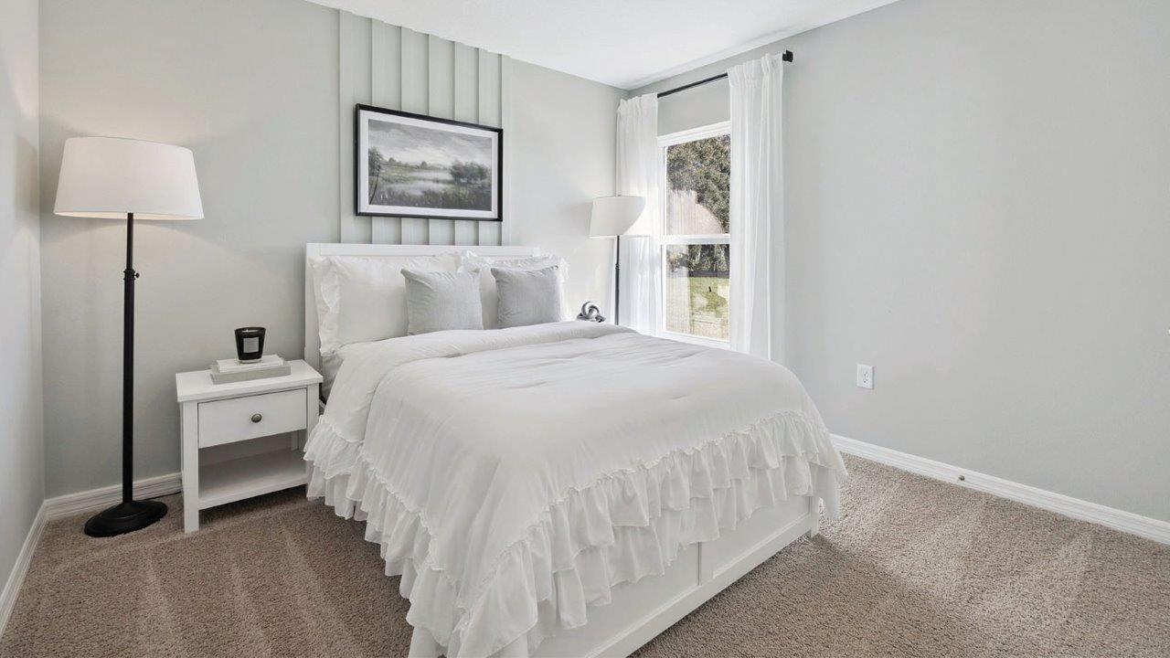 guest bedroom with carpet
