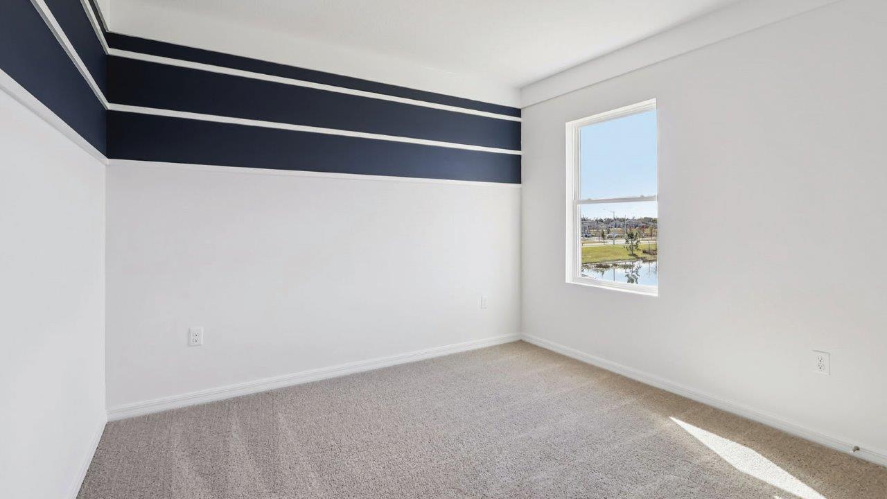 Guest bedroom with wall stripe and window
