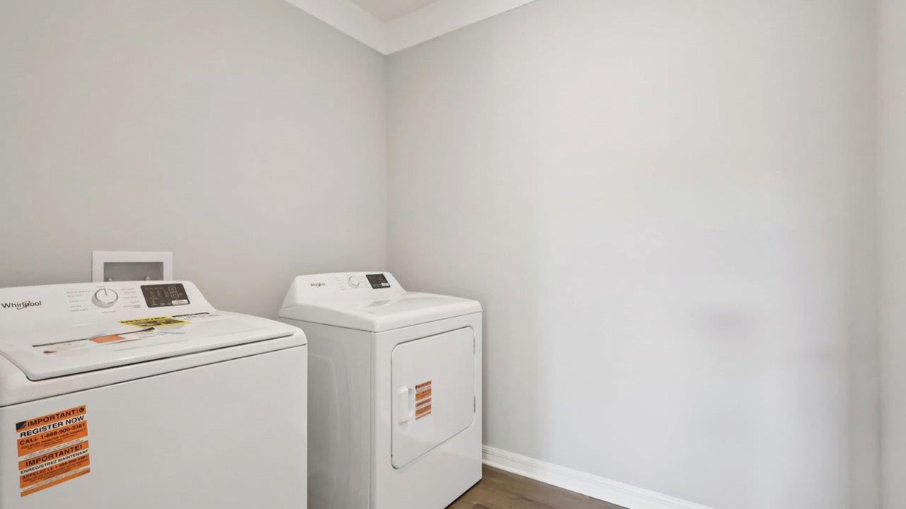 Upstairs laundry room with washer and dryer