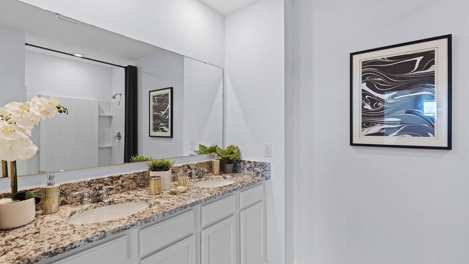 Primary bathroom with double vanity sinks