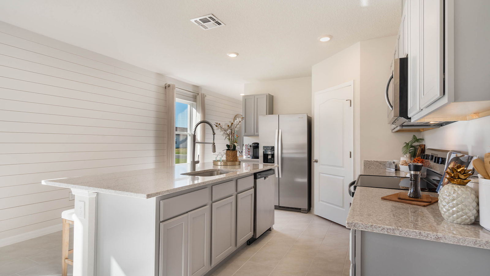 Kitchen with stainless steel appliances and island