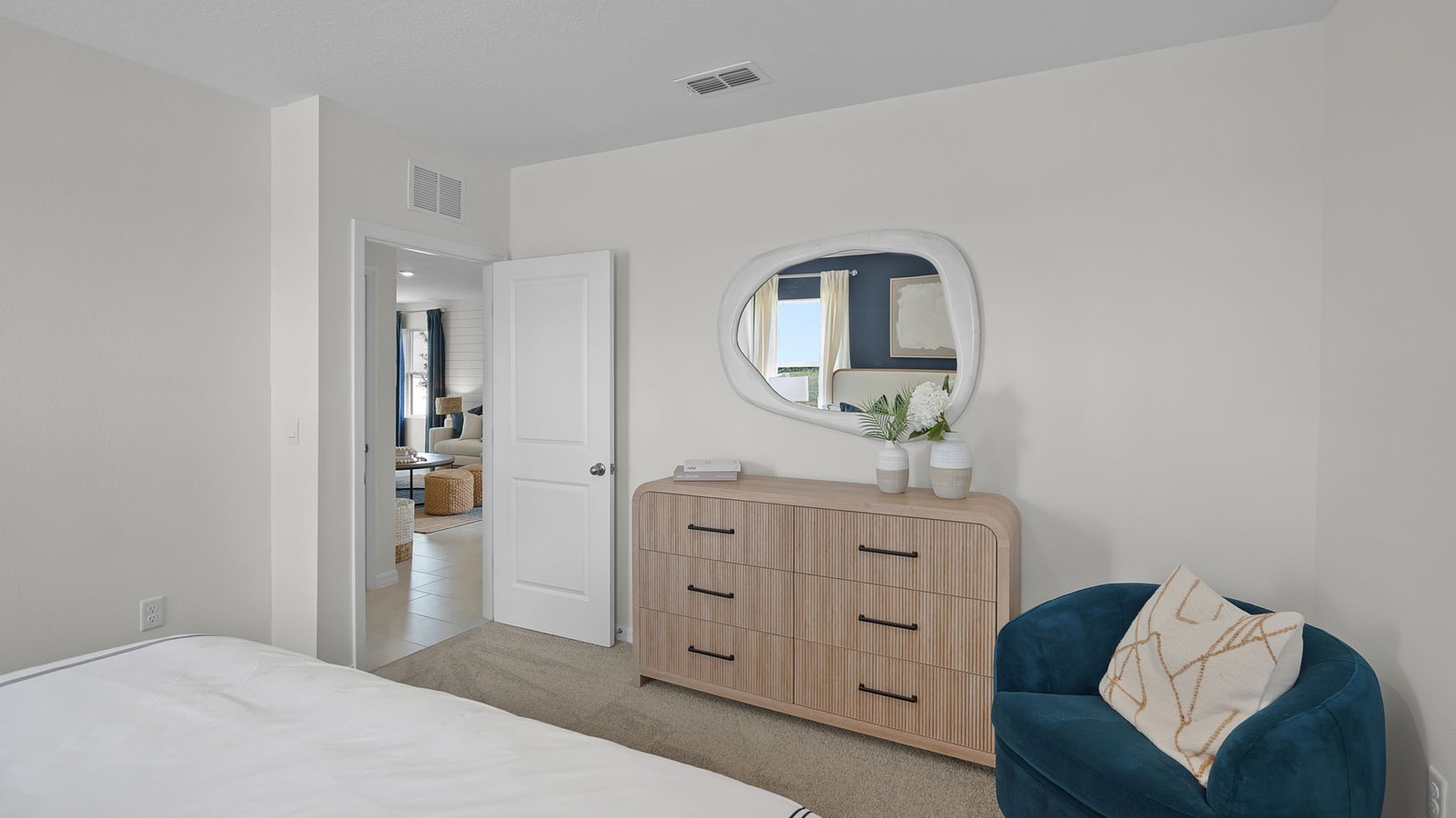 Primary bedroom with sitting area looking out to the living room