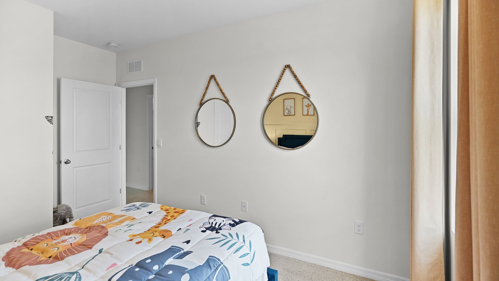 Guest bedroom with full size bed and young child decor