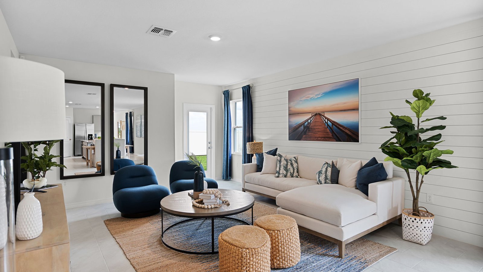 Spacious living room with couch and additional chairs