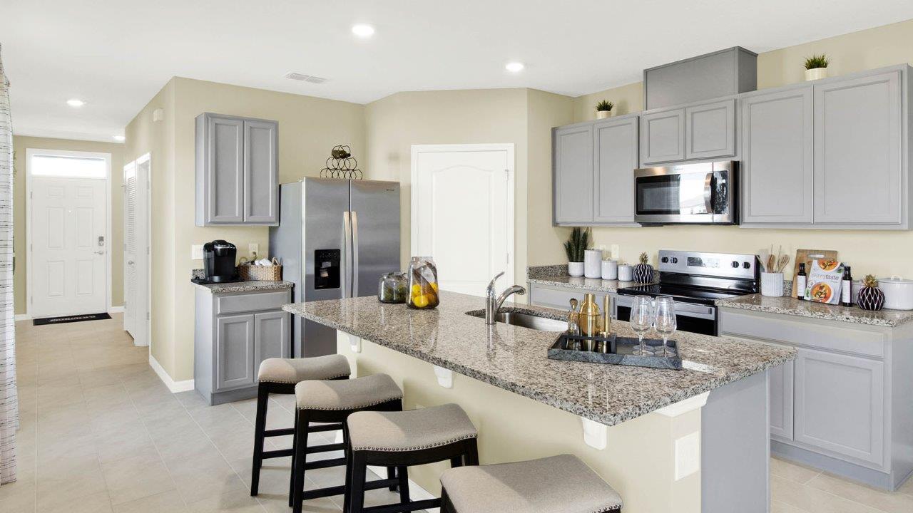 Spacious kitchen with pantry and quartz counter tops
