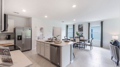 Kitchen island overlooking dining room and living room