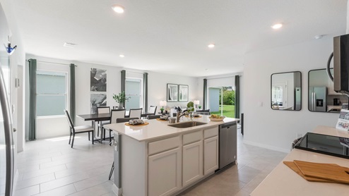 Kitchen with quartz countertops and stain-less steel appliances
