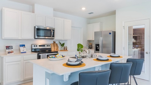 Kitchen island with barstools and sink