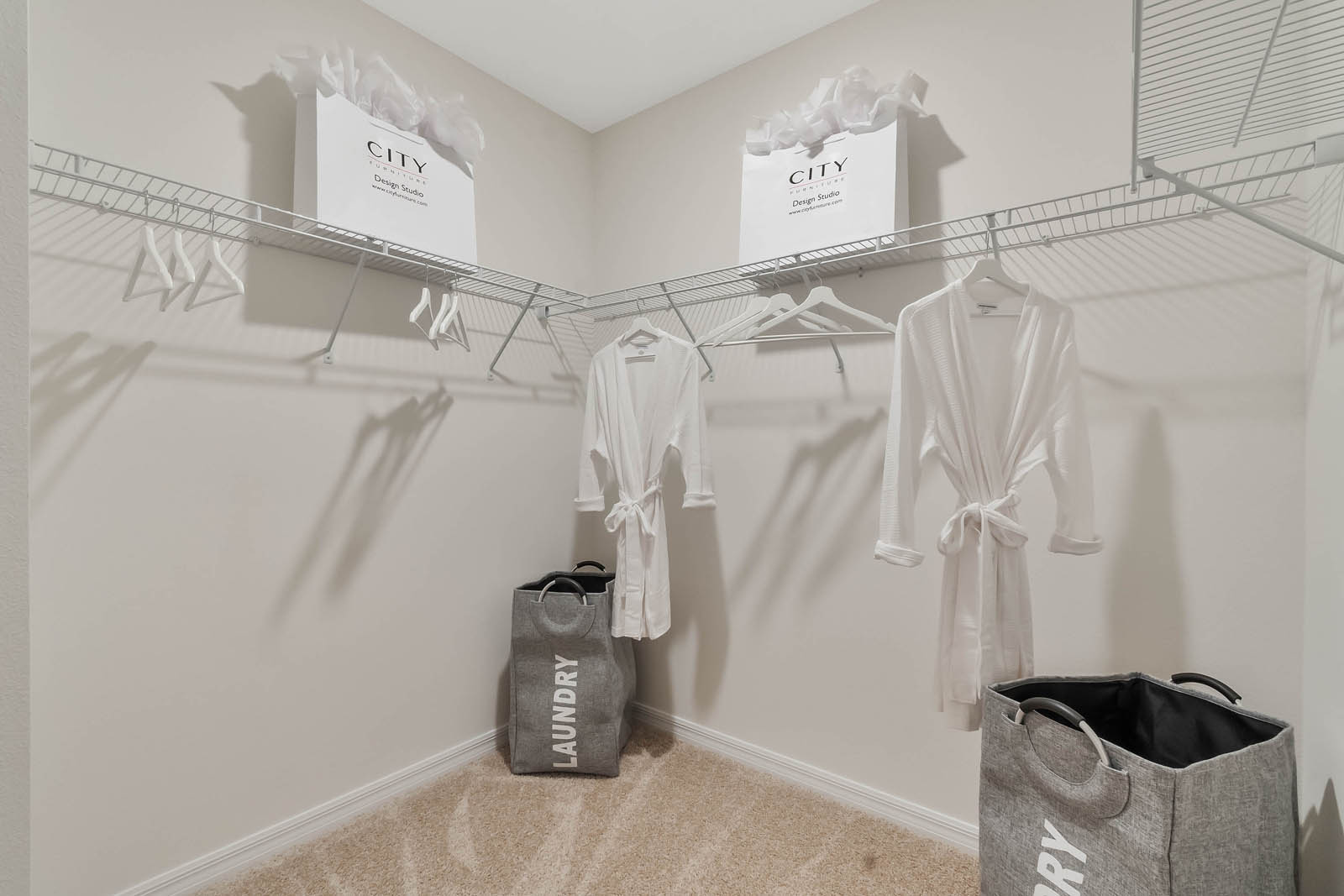 Primary bedroom walk in closet