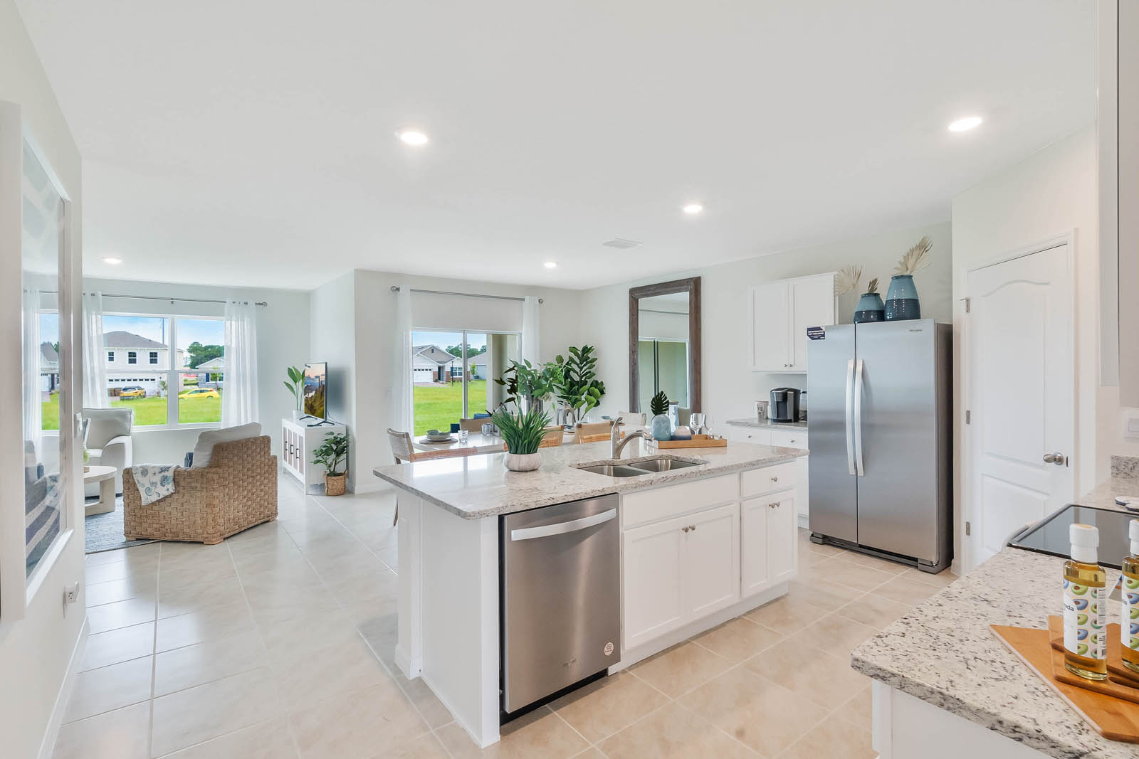 Open concept kitchen with view to the dining area and living room