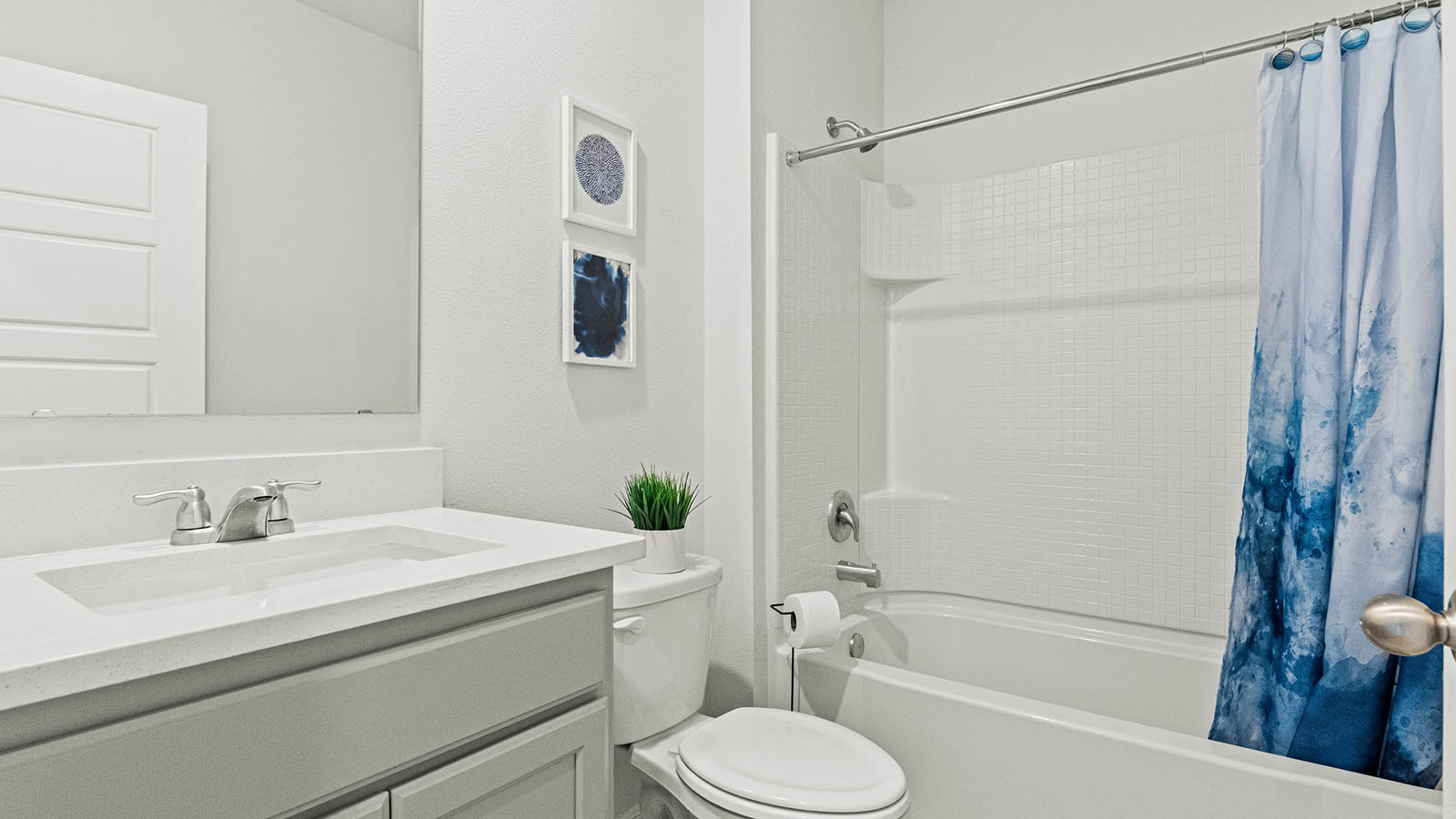 Main floor guest bathroom with tub