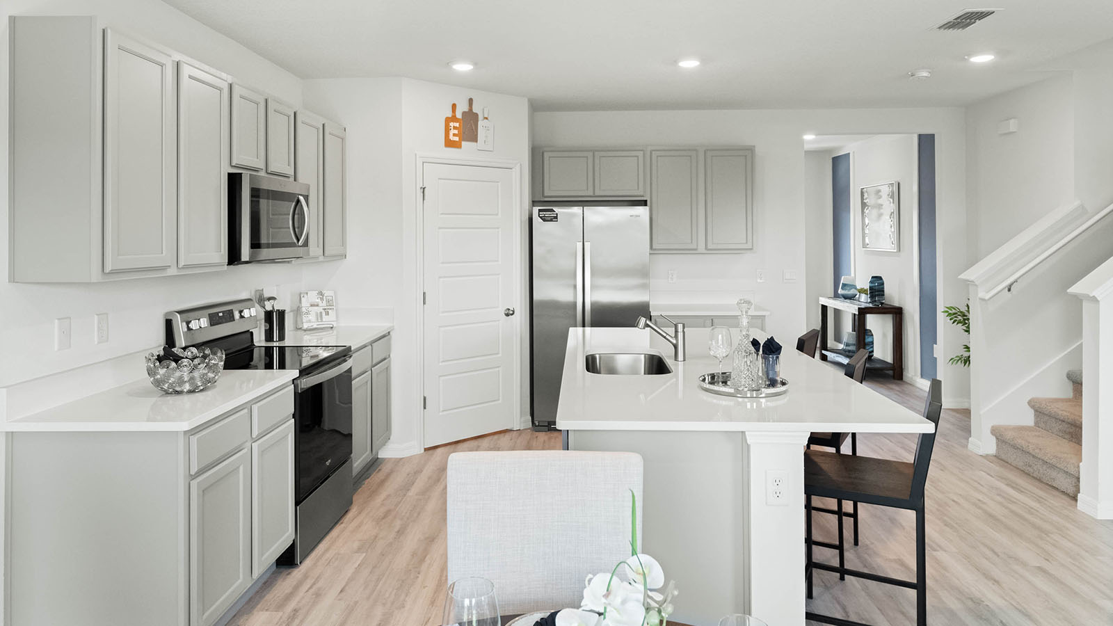 Spacious kitchen with large island and stainless steel appliances