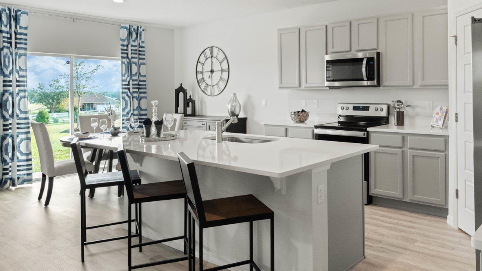 Kitchen island with eating space and quartz counter tops