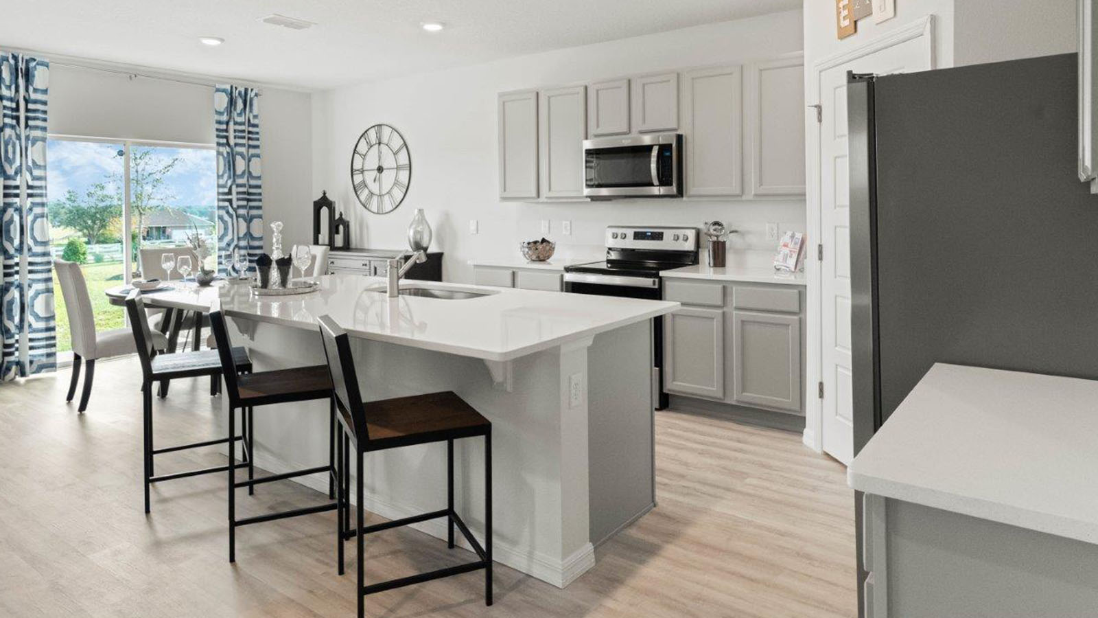 Kitchen with gray cabinets and large island