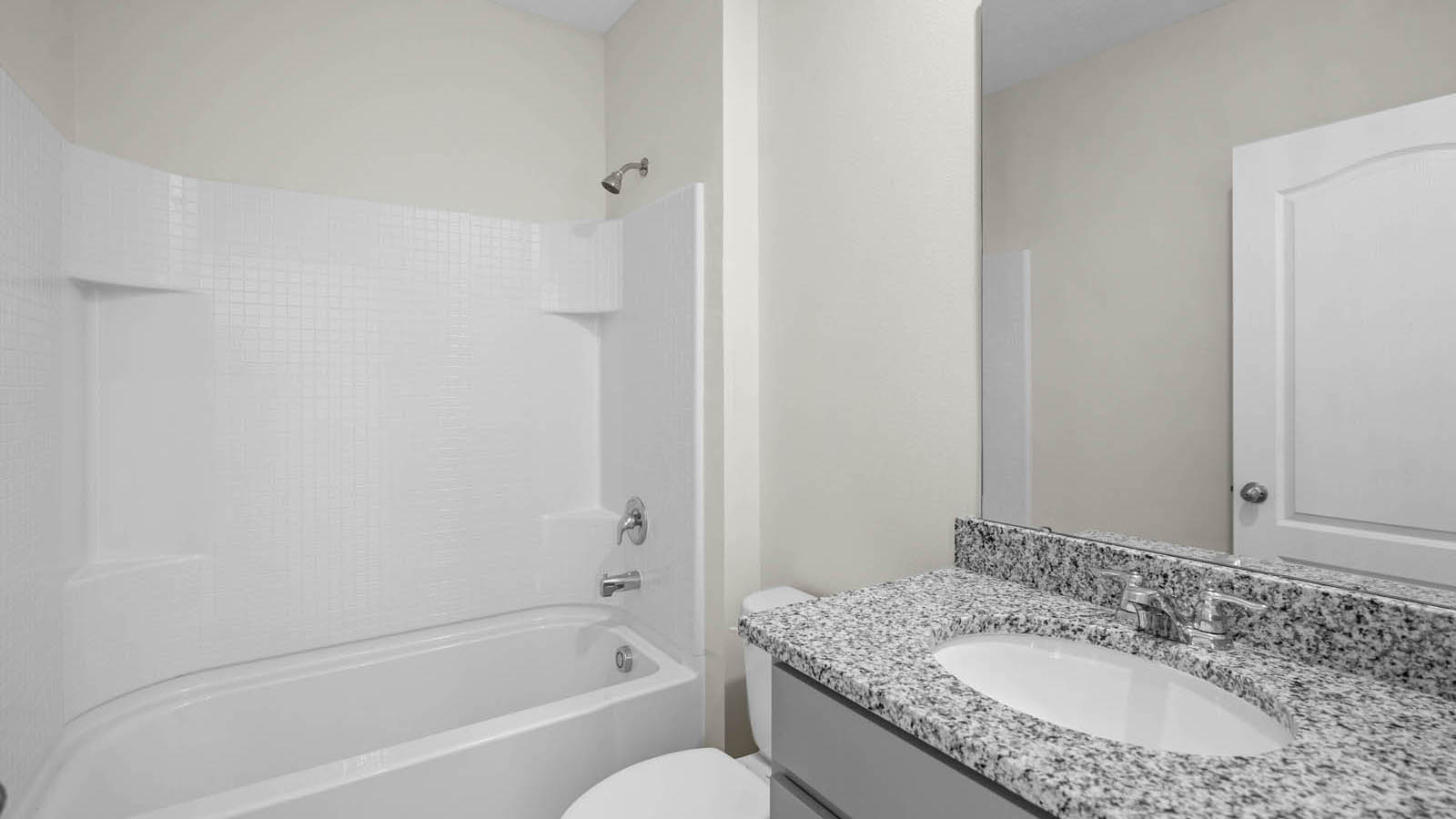 Main floor guest bathroom with tub