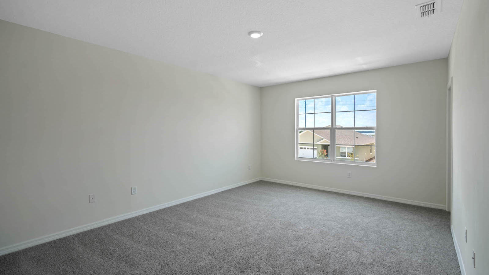 Primary bedroom with carpet