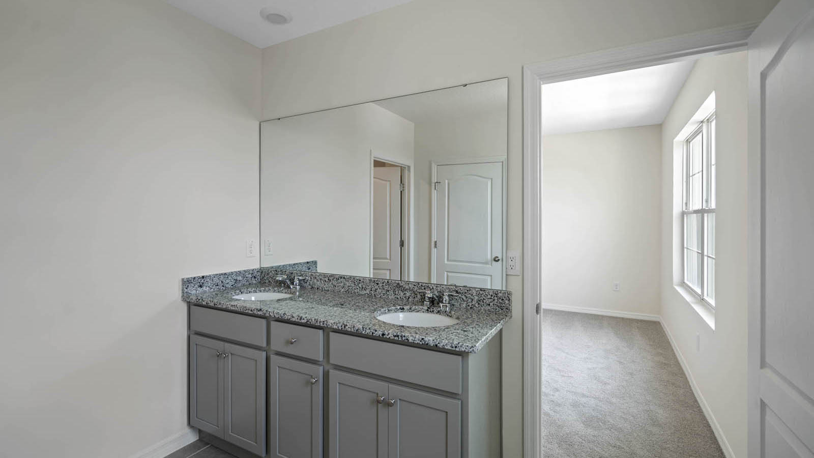 Primary bathroom with double vanity sinks