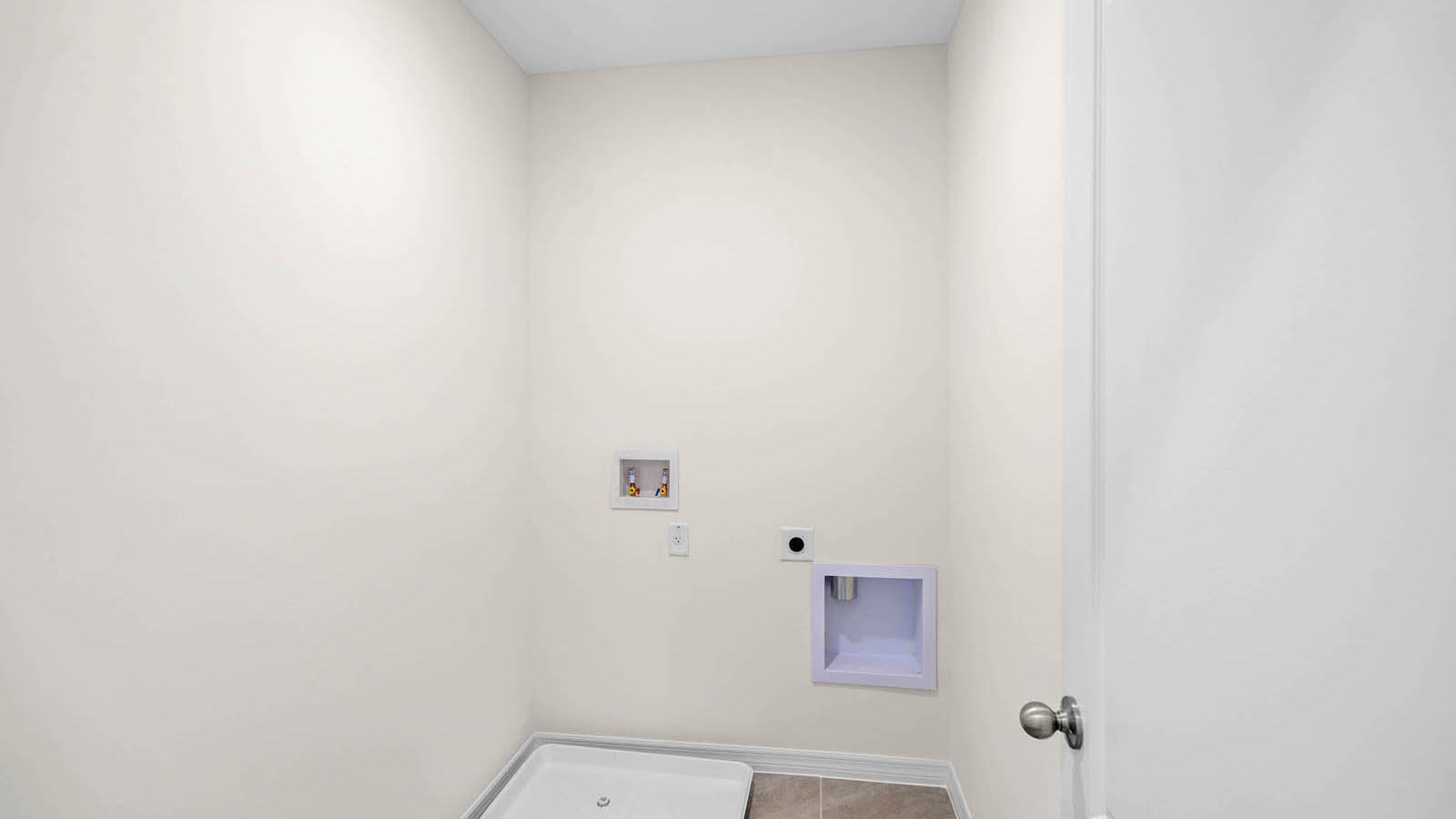 second-floor laundry room with washer and dryer