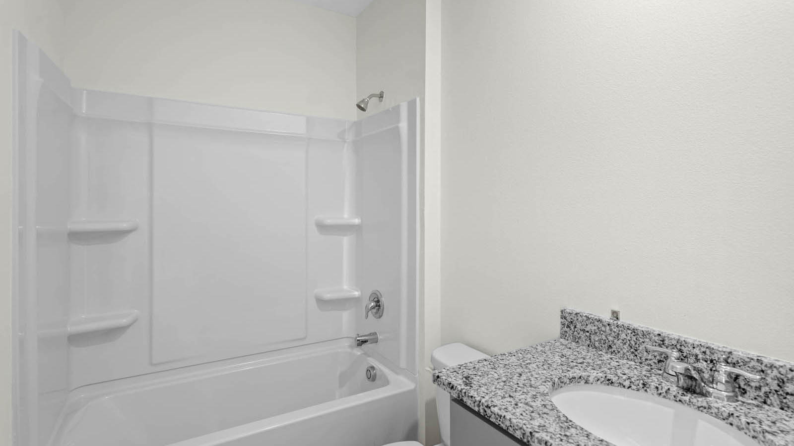 Second-floor guest bathroom with tub