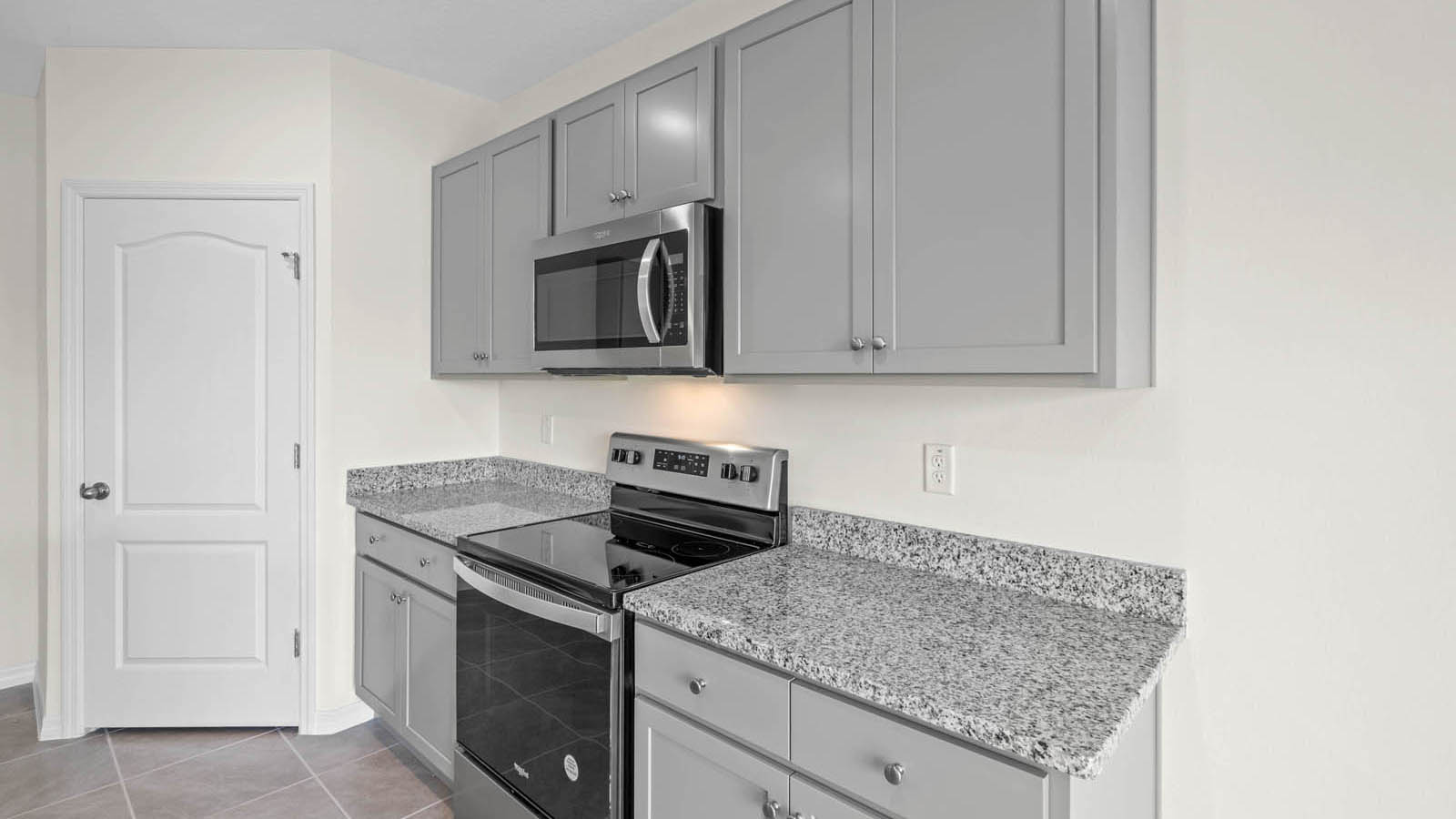 Spacious kitchen counter tops and stainless steel appliances