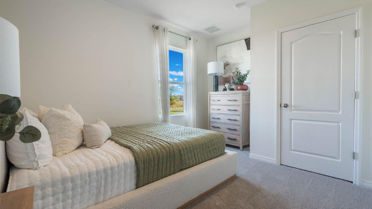 Primary bedroom with kind size bed