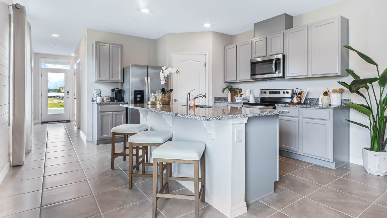Kitchen with island and barstools