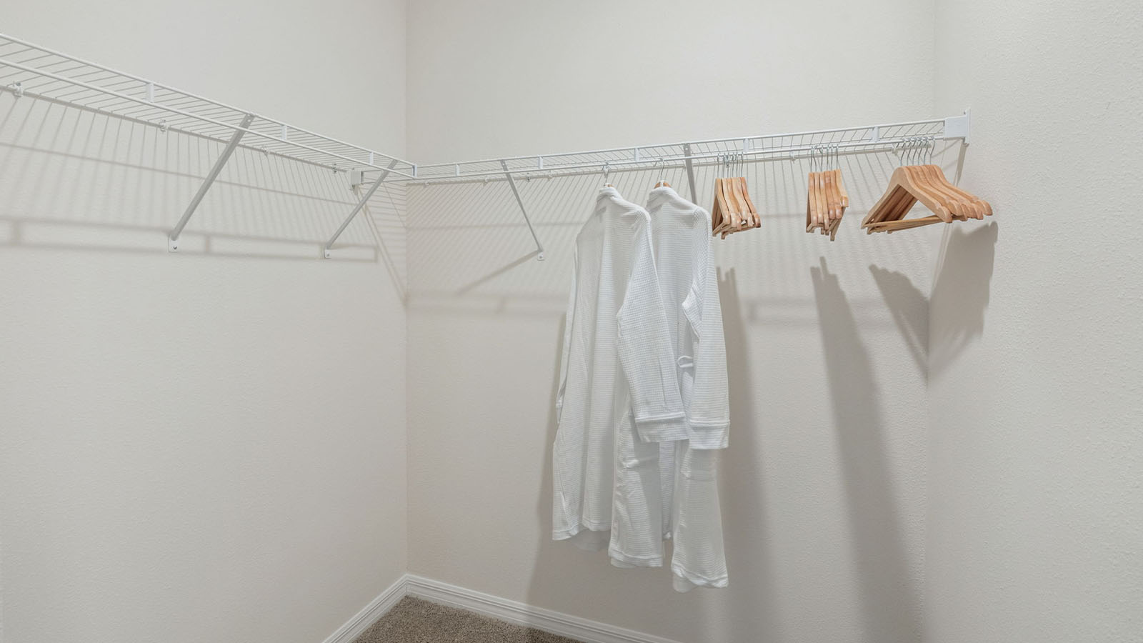 Primary bedroom walk in closet