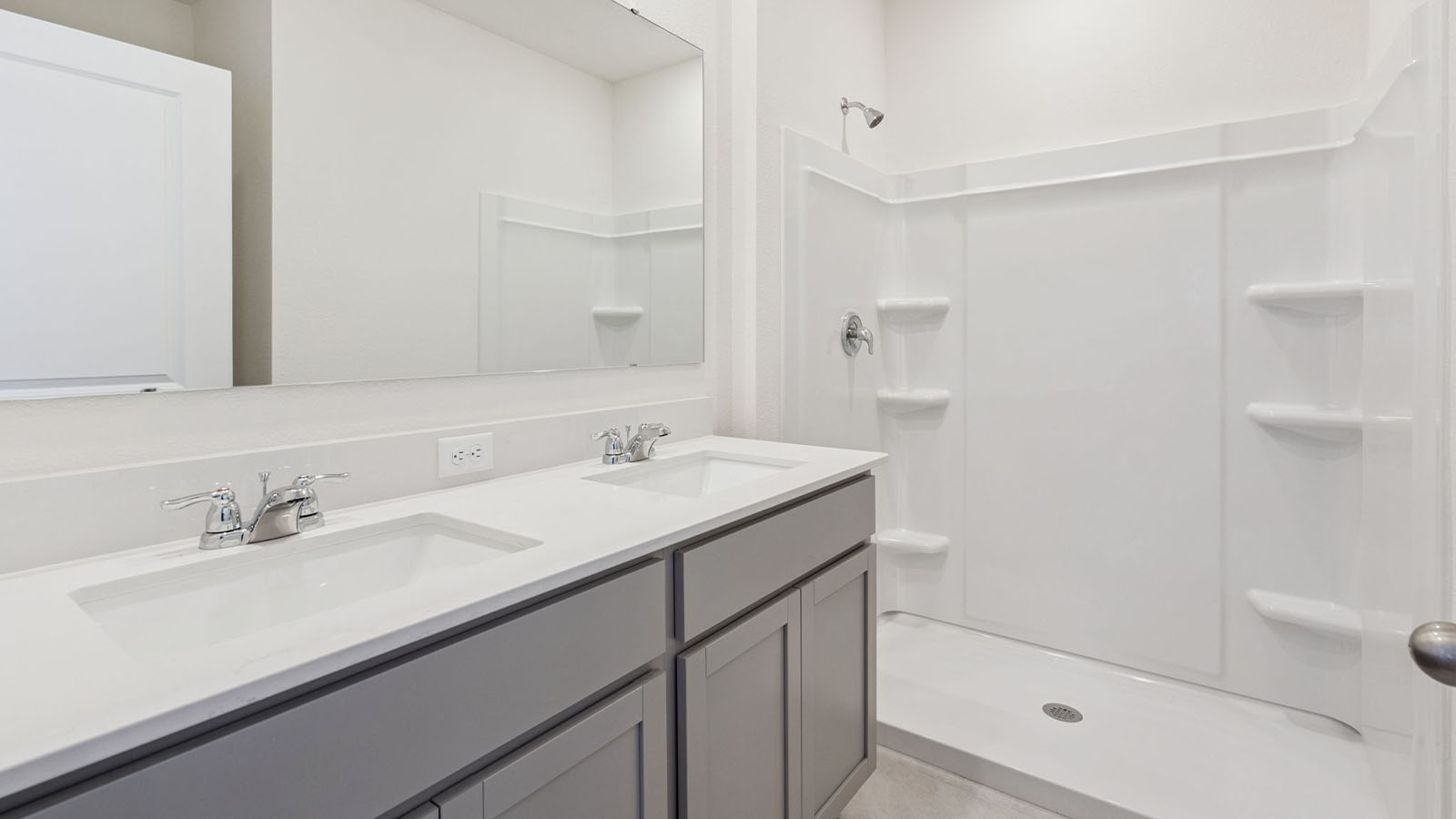 Primary bathroom with dual vanity sinks