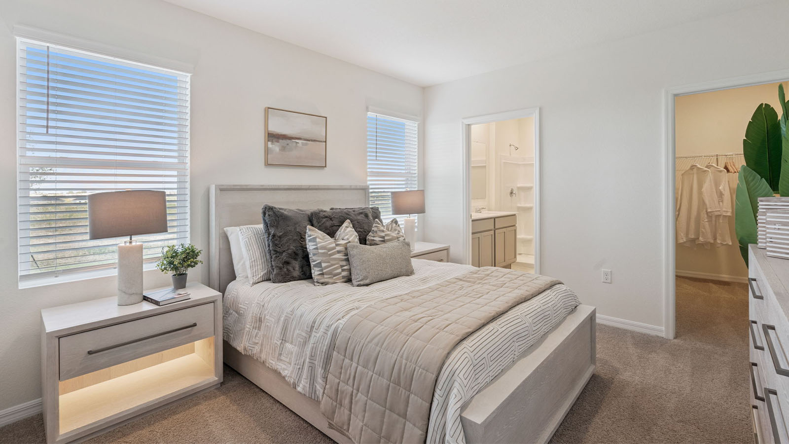 Primary bedroom with queen size bed and walk in closet