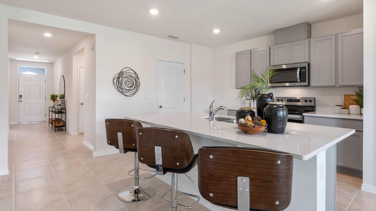Kitchen with island and barstools