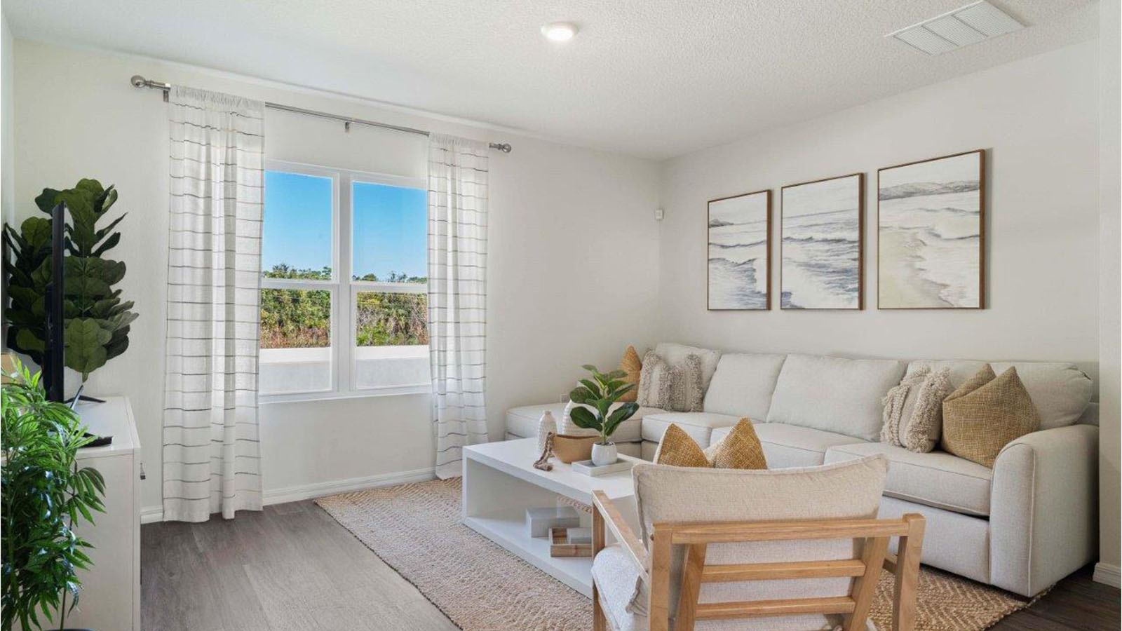 Living room with two windows and secitonal couch