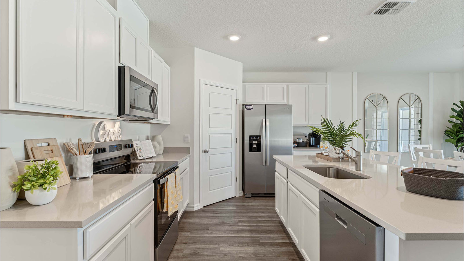 Kitchen with stainless-steel appliances and walk-in pantry