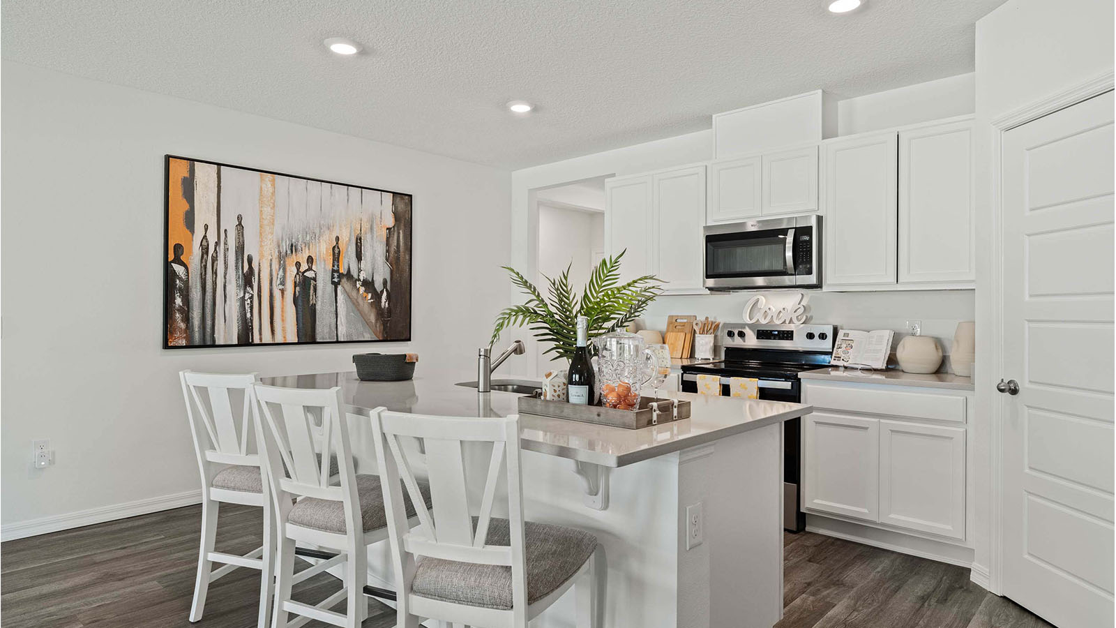 Kitchen with artwork and seating at island