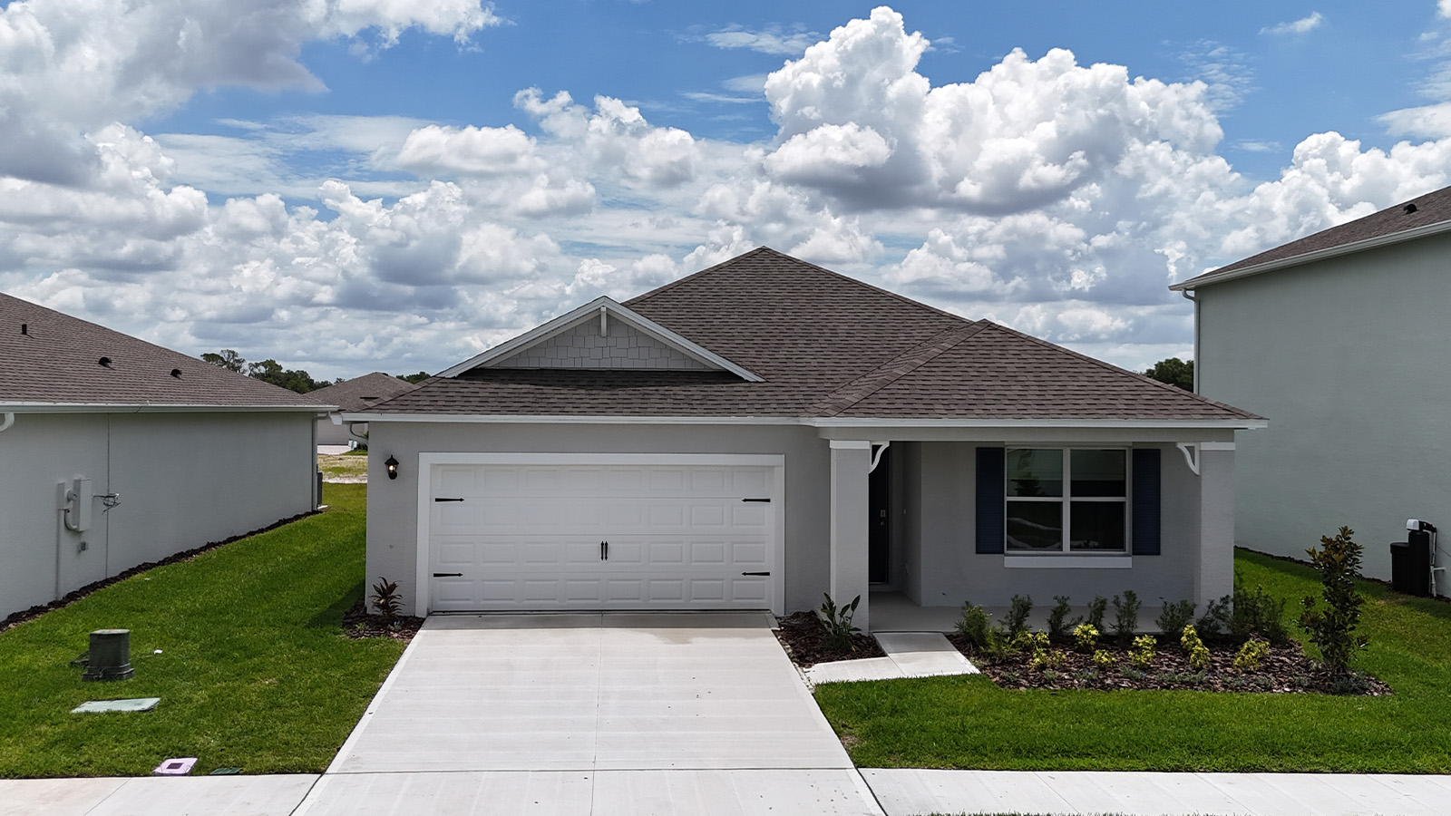 Front exterior image of single-family home with two-car garage and front porch