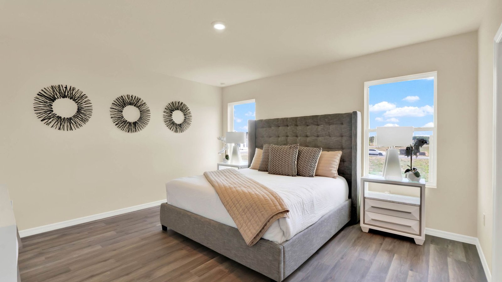 Primary bedroom with large bed and night stands