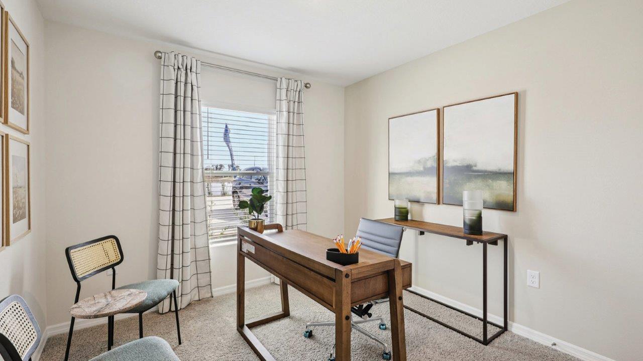 Guest bedroom decorated with office