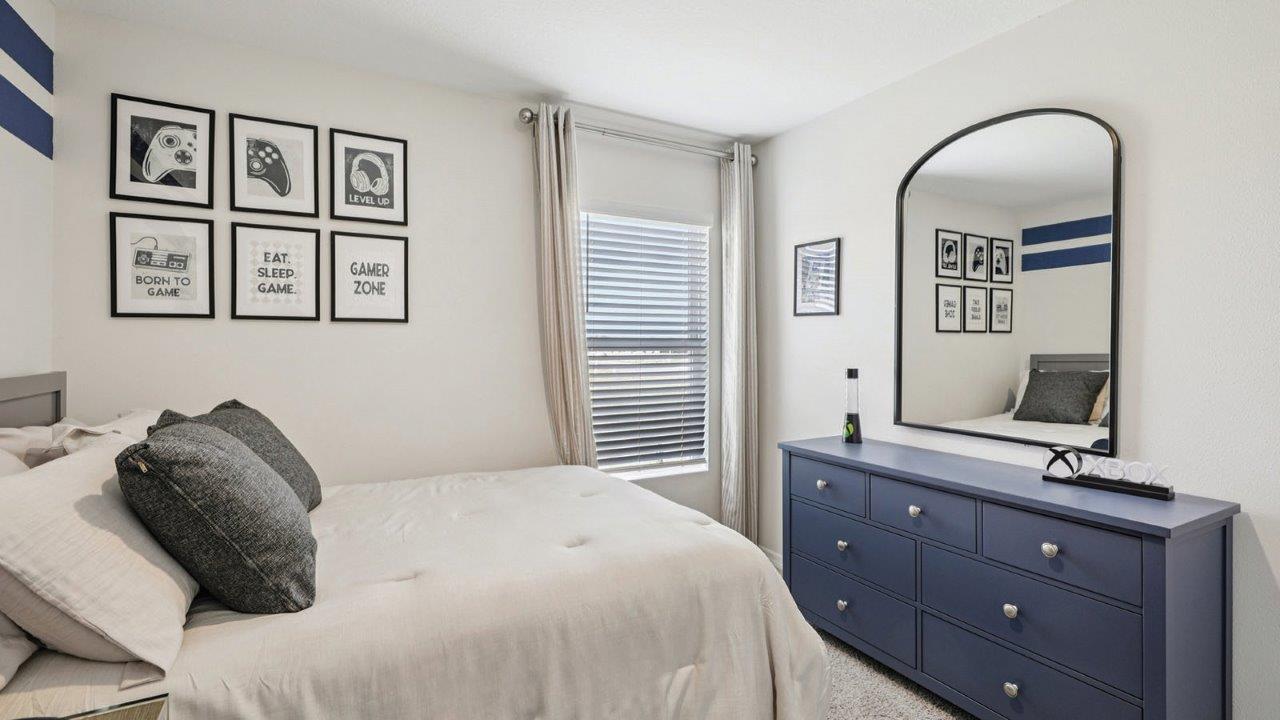 Guest bedroom with full size bed and dresser