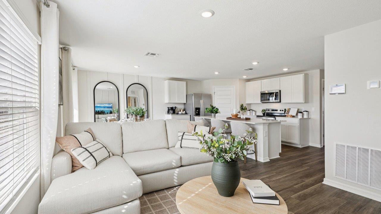 Living room showing open kitchen and dining