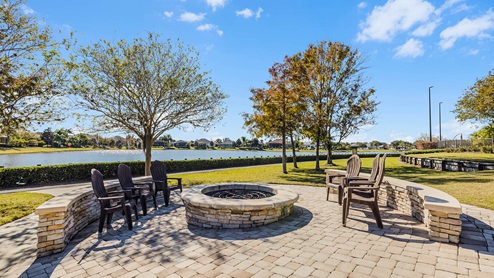 Outdoor firepit with seating near lake
