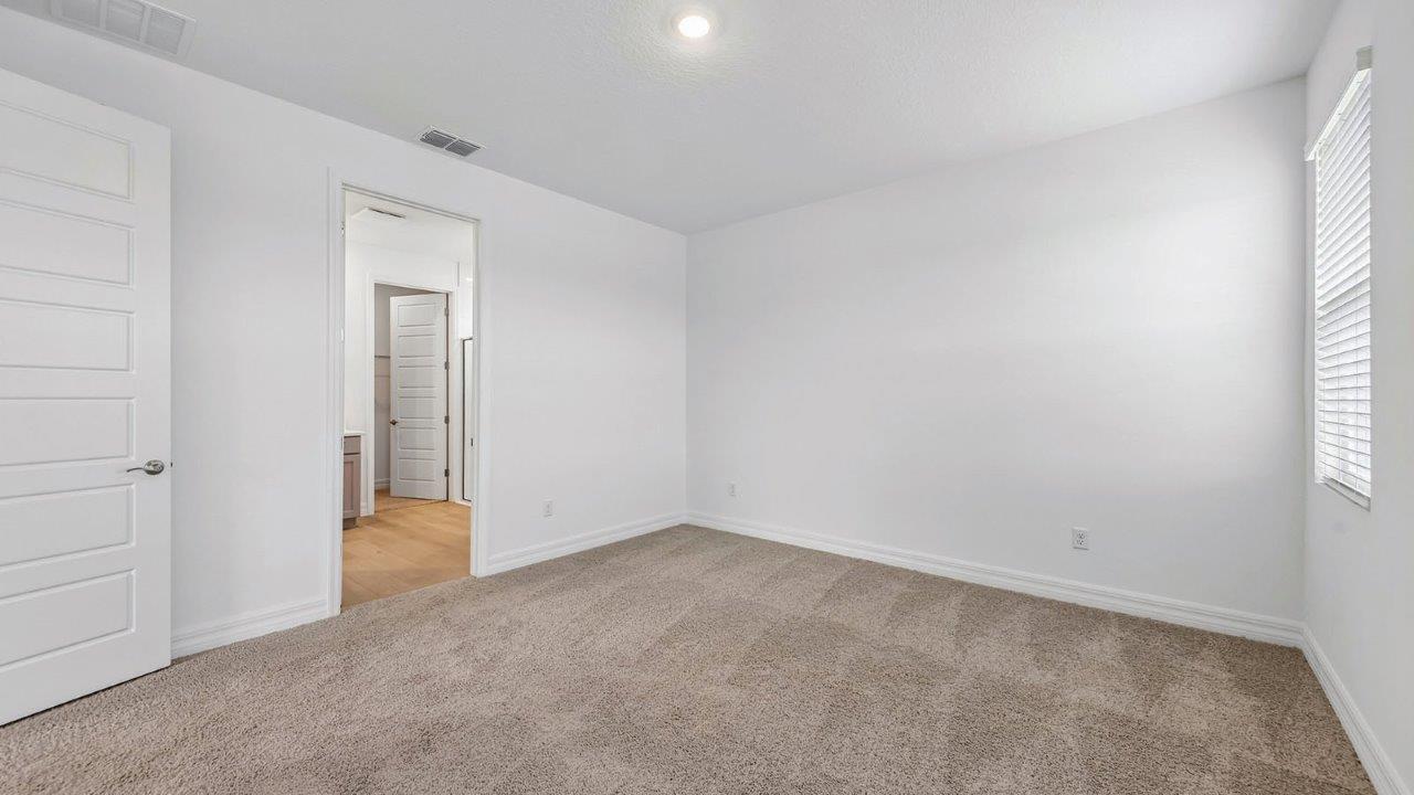 Primary bedroom and bathroom